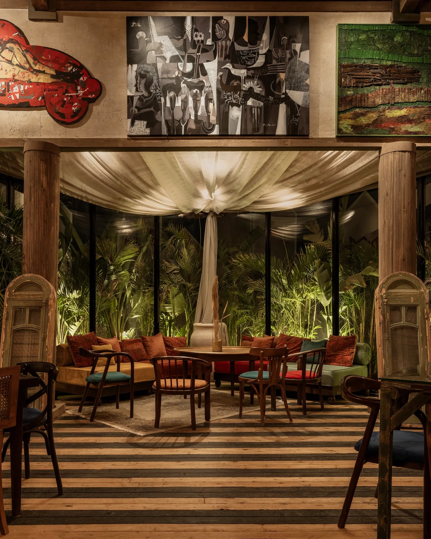 A layered view through Babbo's dining room toward the garden windows