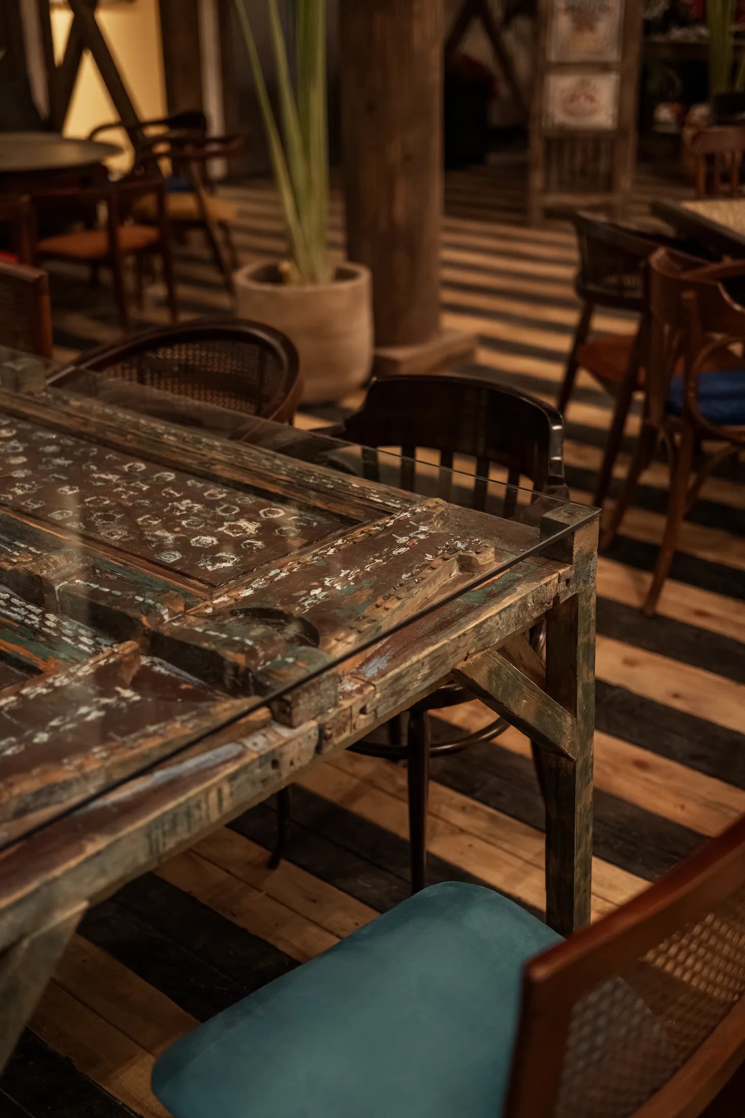 Decorative tabletop and upholstered seating detail at Babbo's