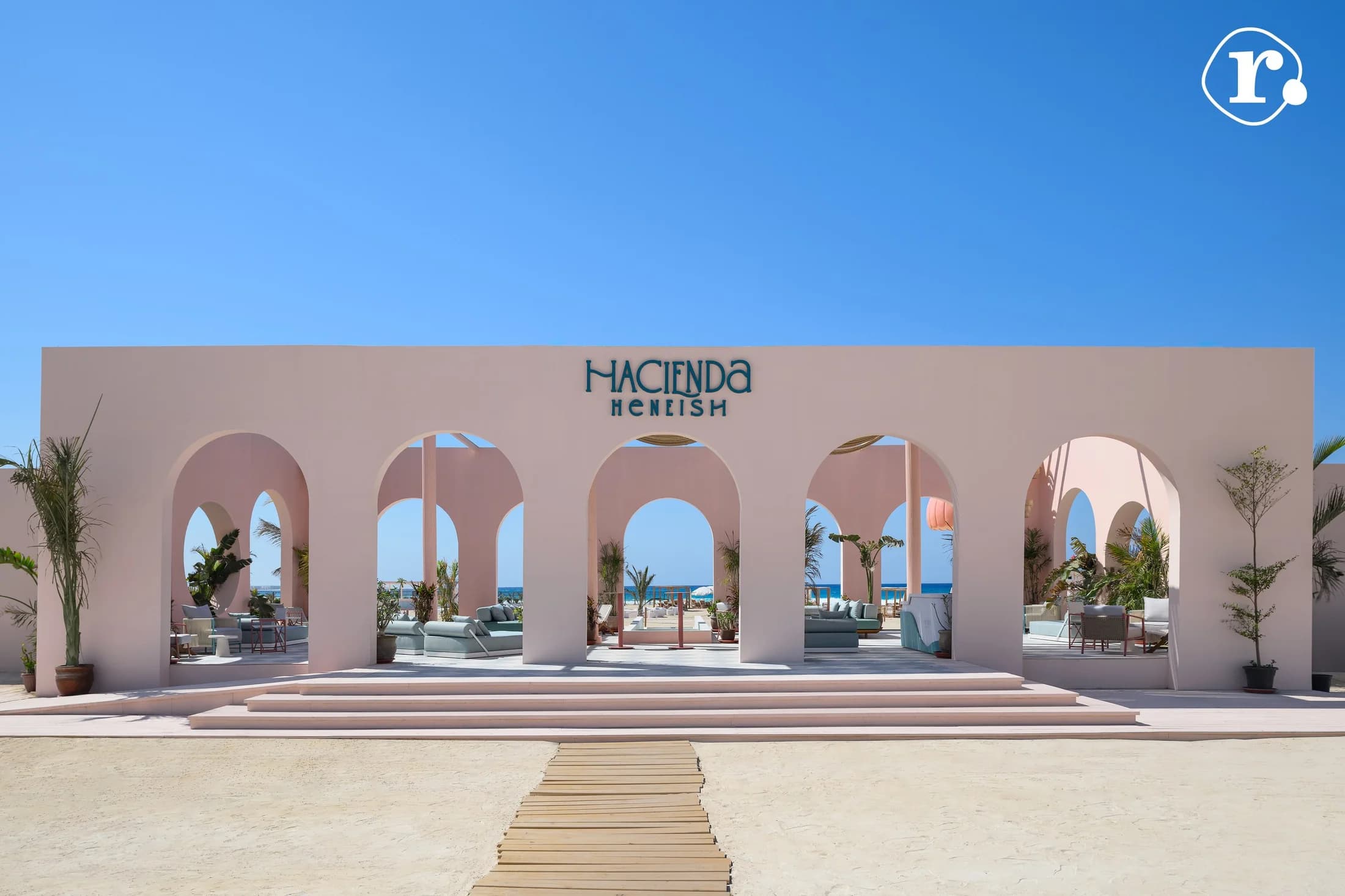 Pink Hacienda Heneish entrance and central walkway in daylight
